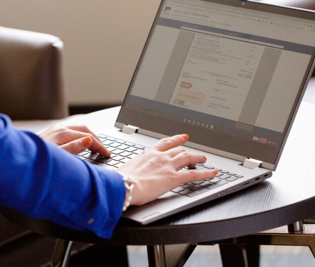 Woman typing on laptop