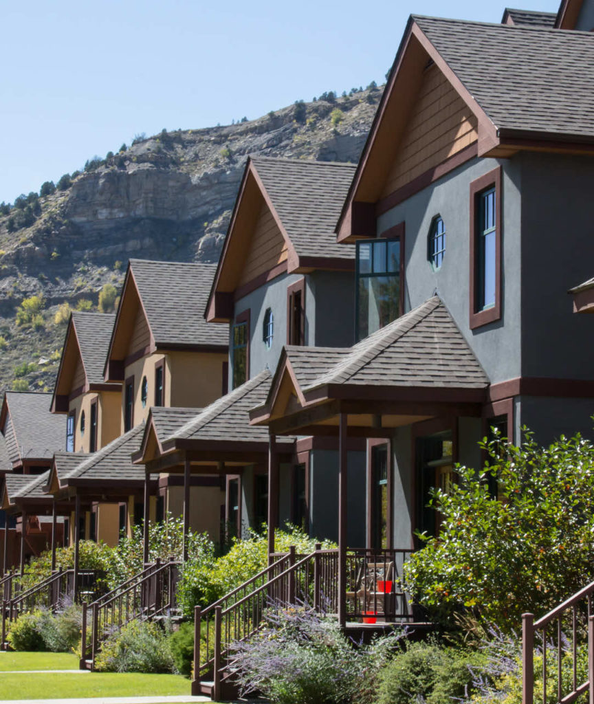 Row of homes with a mountain behind